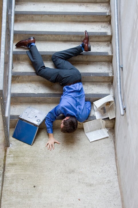 man falling down steps