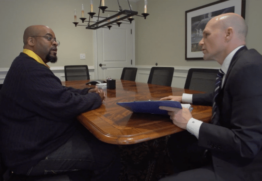 Brown meeting with a client