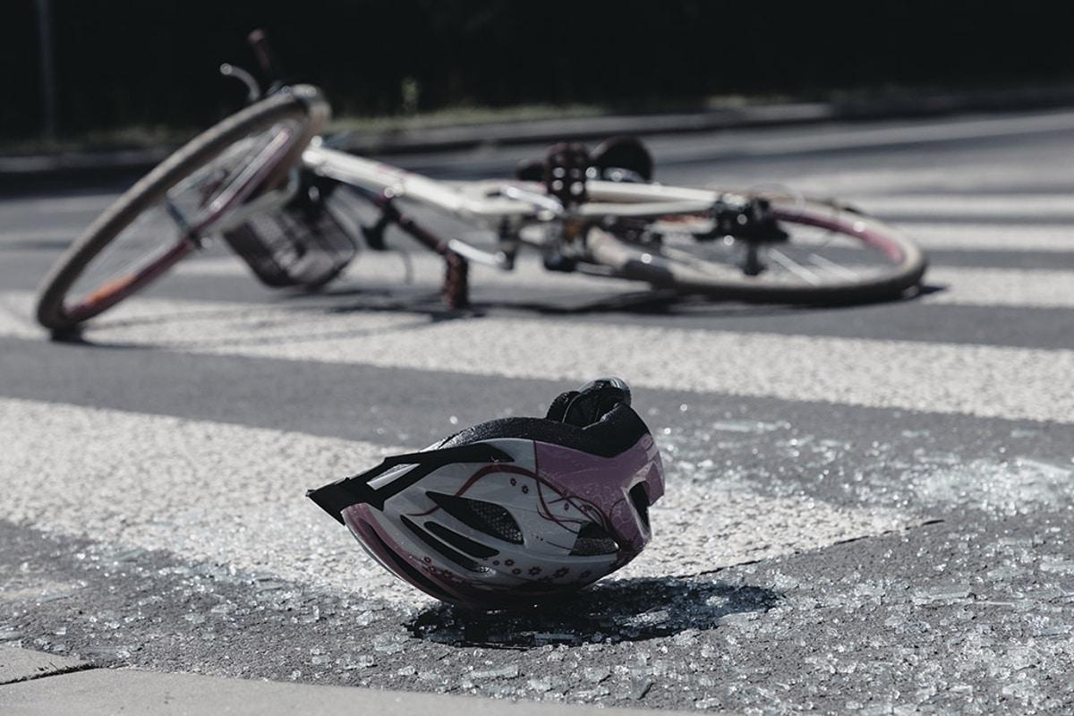 car runs into crosswalk and injuries cyclist