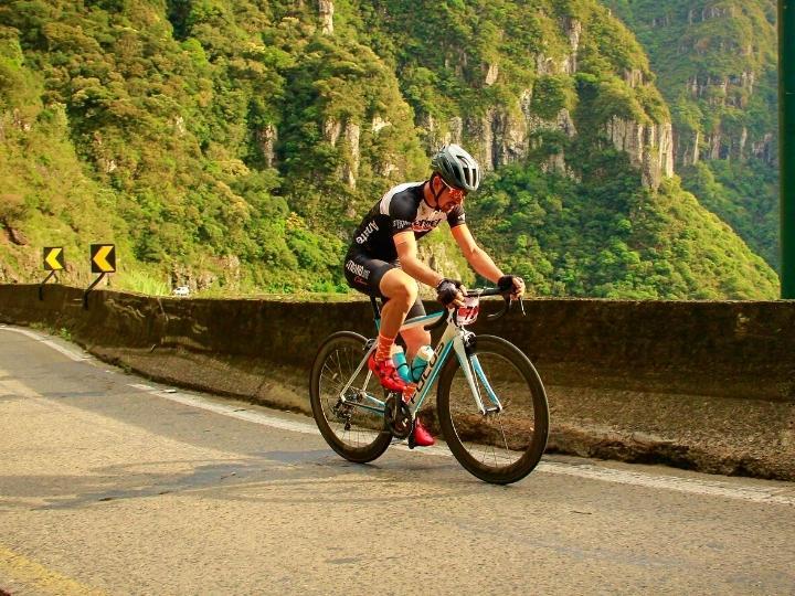 cyclist-riding-on-winding-road