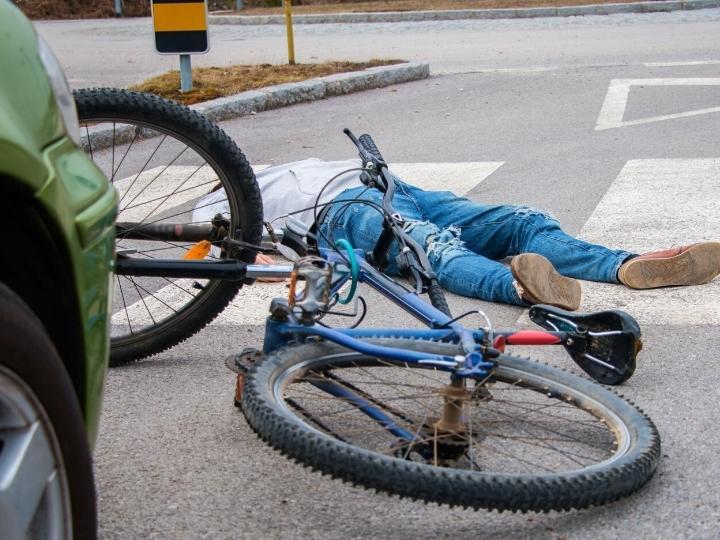 man-is-hit-by-a-car-on-his-bicycle