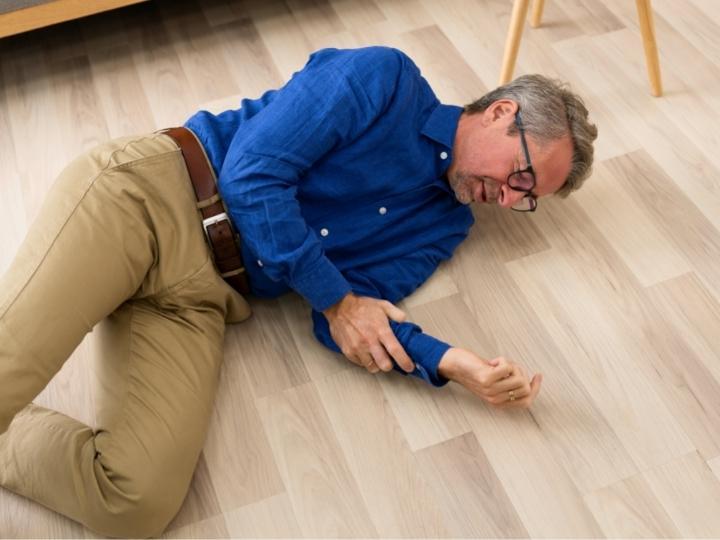 man-falls-on-uneven-flooring